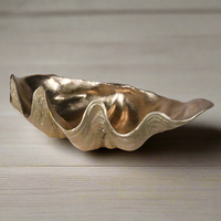 Gold resin shell bowl, stunning accessory for a bathroom or any room that needs a touch of gilt glamour. Gold resin shell bowl, stunning accessory for a bathroom or any room that needs a touch of gilt glamour.
