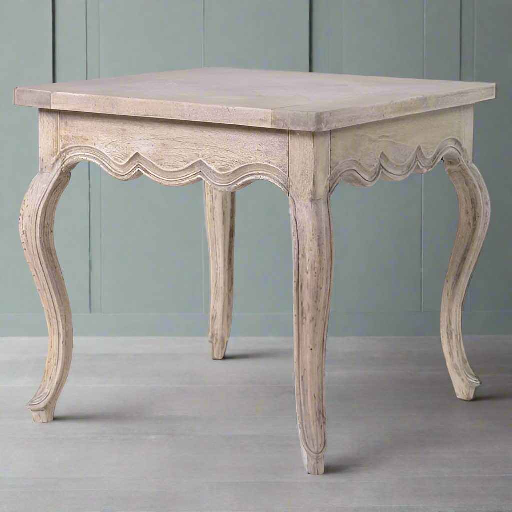 Pale acacia wood side table with vintage style curved legs, curved frieze edge and a parquet top. An unusually decorative table, in a pale colour with vintage flourishes.

W: 56 cm D: 56 cm H: 54 cm