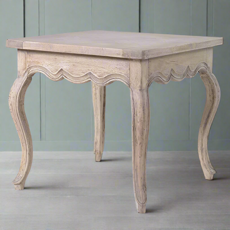 Pale acacia wood side table with vintage style curved legs, curved frieze edge and a parquet top. An unusually decorative table, in a pale colour with vintage flourishes.

W: 56 cm D: 56 cm H: 54 cm