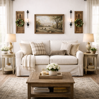 Cozy living room with a white sofa, wooden coffee table, and decorative elements.