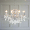 Silver shallow 8-arm crystal chandelier with cut-crystal droplets.