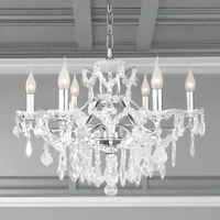 Six-arm brushed silver chandelier with crystal droplets and shallow basket design, suitable for low ceilings.