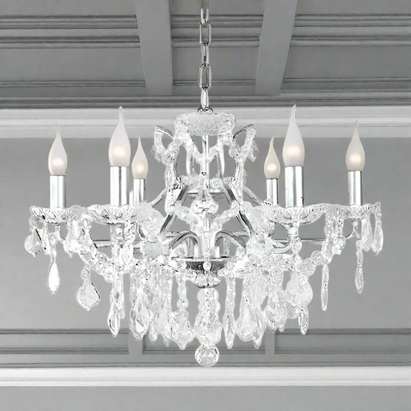 Six-arm brushed silver chandelier with crystal droplets and shallow basket design, suitable for low ceilings.