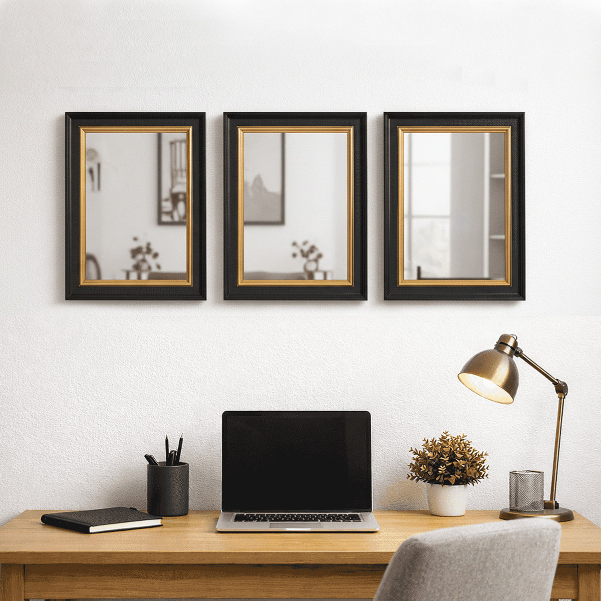 The simple, black and gold 40cmx30cm rectangular mirror, perfect for a smaller room, in a study