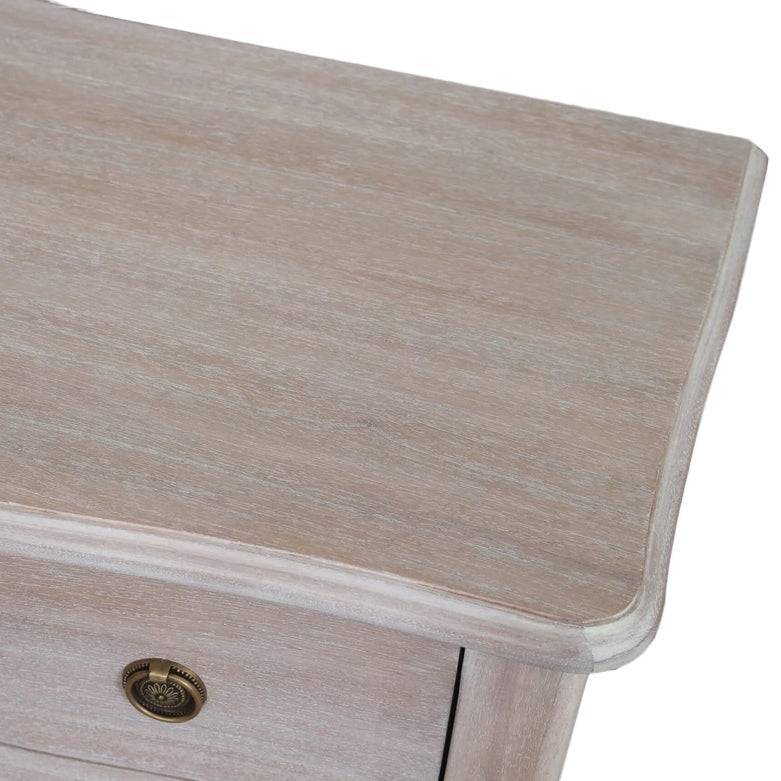 Close-up of a soft off white wooden three drawer chest with smooth finish and rounded edges, showcasing quality craftsmanship and elegant storage design