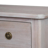 Close-up of a soft off white wooden three drawer chest with brass knob, showcasing smooth finish and detailed craftsmanship.