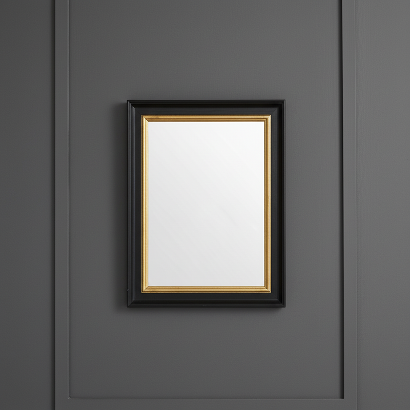 The simple, black and gold 40cmx30cm rectangular mirror, perfect for a smaller room on a plain background.