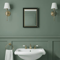 The simple, black and gold 40cmx30cm rectangular mirror, perfect for a smaller room, in a bathroom
