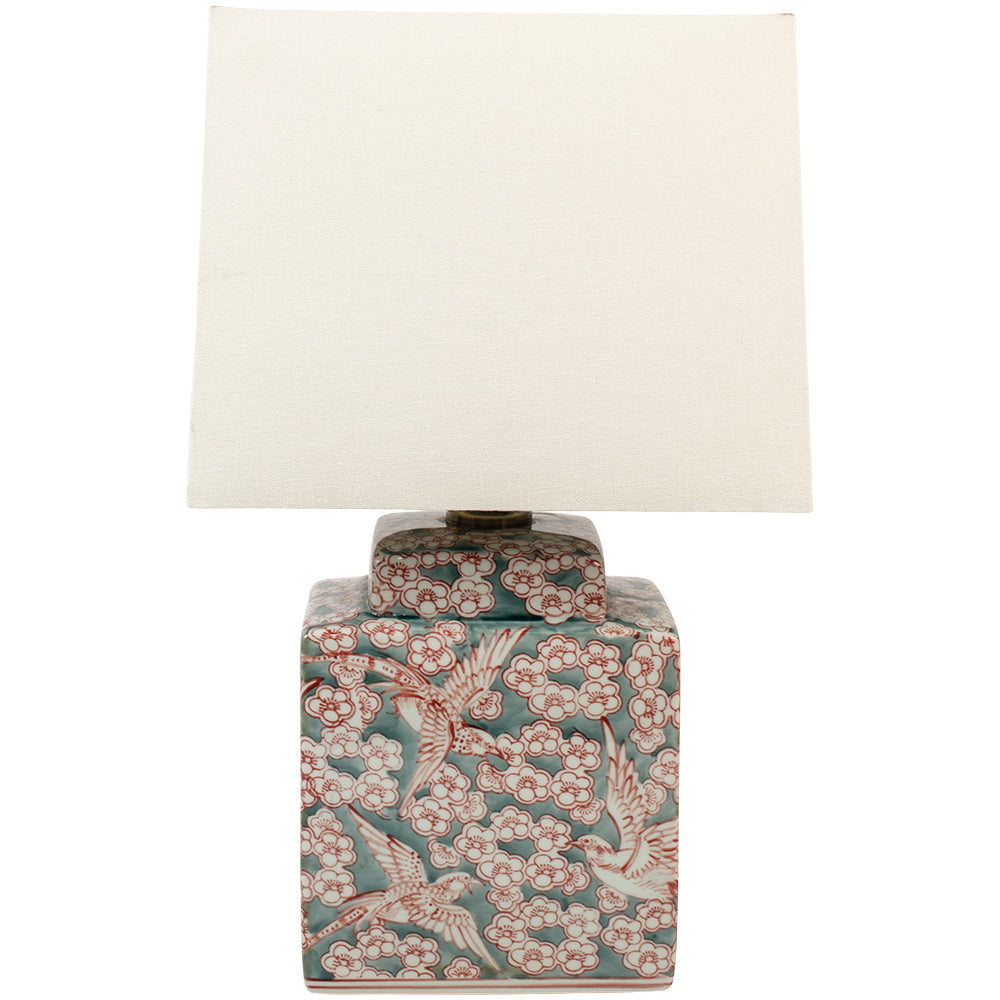 A delicate fauna and flora sage green and red ceramic lamp base with a white linen shade.&nbsp; Small enough to use as bedside lamps or as a small side lamp where your space will be transformed into a cosy area.&nbsp; The white linen shades diffuses ample light on this ceramic lamp and you can choose from our recommended bulbs below to get the colour temperature right for your room. We have a wide range of ceramic lamps on our site for your to choose from, all colours and sizes.