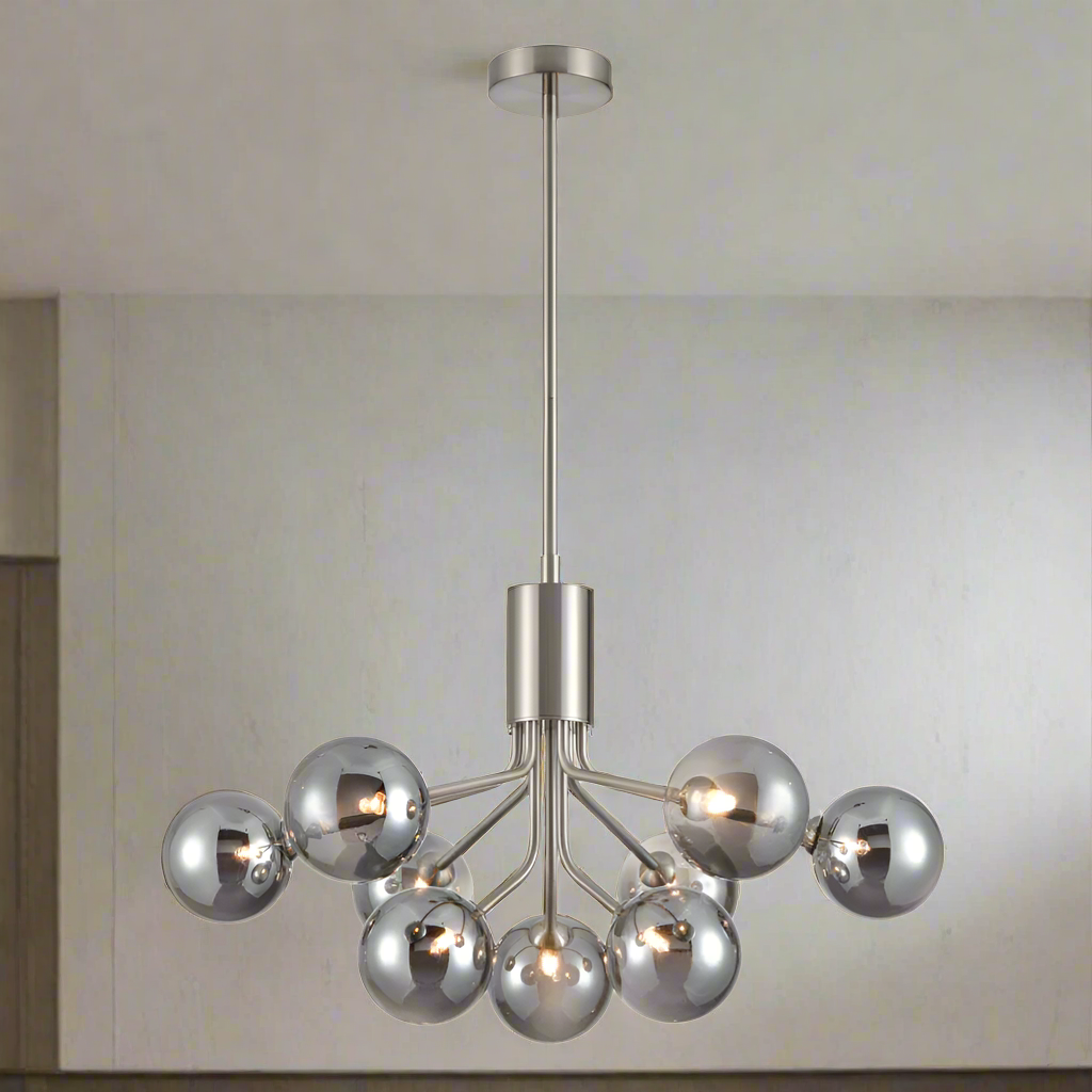 A stunning statement light that diffuses ample light around your home. Nine smoked glass shades attached to an adjustable or extendable brass rod. 