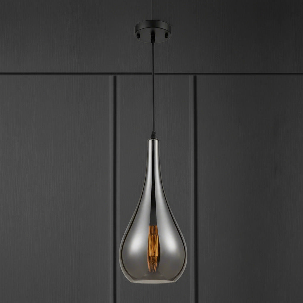 smoked glass pendant light with slim teardrop shape and angled cut glass hanging from a dark ceiling rose