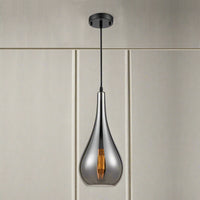 smoked glass pendant light with slim teardrop shape and angled cut glass hanging from a dark ceiling rose