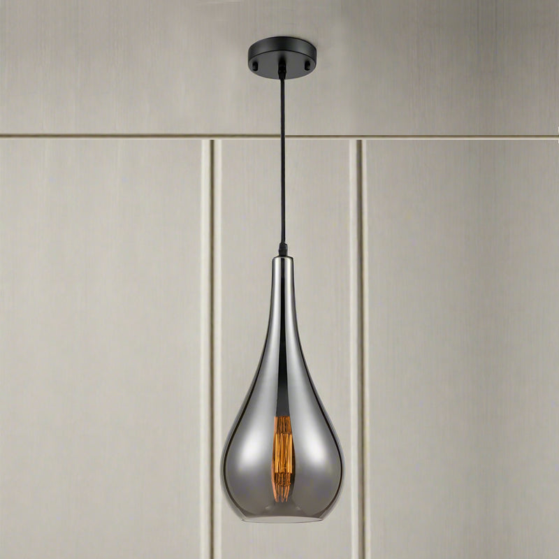 smoked glass pendant light with slim teardrop shape and angled cut glass hanging from a dark ceiling rose