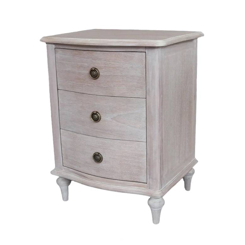 A solid hardwood three draw bedside table made from bleached mahogeny wood with ash veneers in a white wash finish. 
