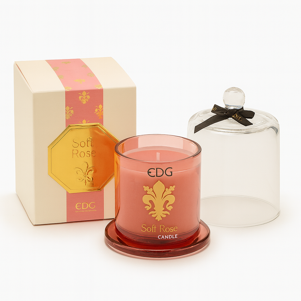 Soft Rose scented candle in pink glass with gold emblem and clear cloche, presented in a matching pink and gold gift box.