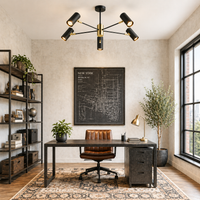 Modern home office with a desk, chair, and decorative elements.