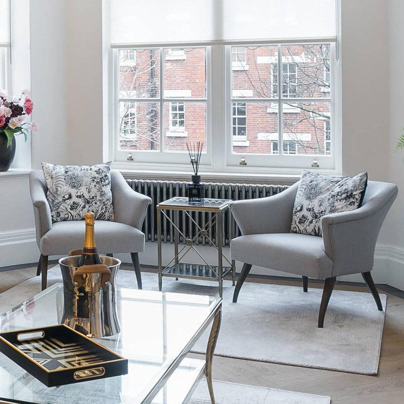 Elegant and super comfortable armchair in a pinstripe fabric.&nbsp; Perfect country house armchair but chic enough for the most contemporary of town house settings. The finely textured pattern in a neutral tone, gives a sophisticated and versatile look. The slightly tapered wooden legs refine that look. This is a substantial piece of furniture which will suit regular use in your busy living room or in a bedroom, lounge or anywhere in the home.&nbsp; A striped armchair that would work everywhere .