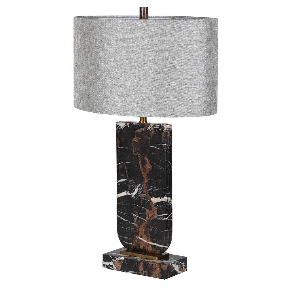 Tall black marble table lamp with rust-brown and white veining, rectangular marble plinth, antique-brass details and a wide grey linen oval shade.
