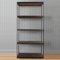 Tall shelving unit with solid mango wood shelves and a slim black metal frame in an industrial style.