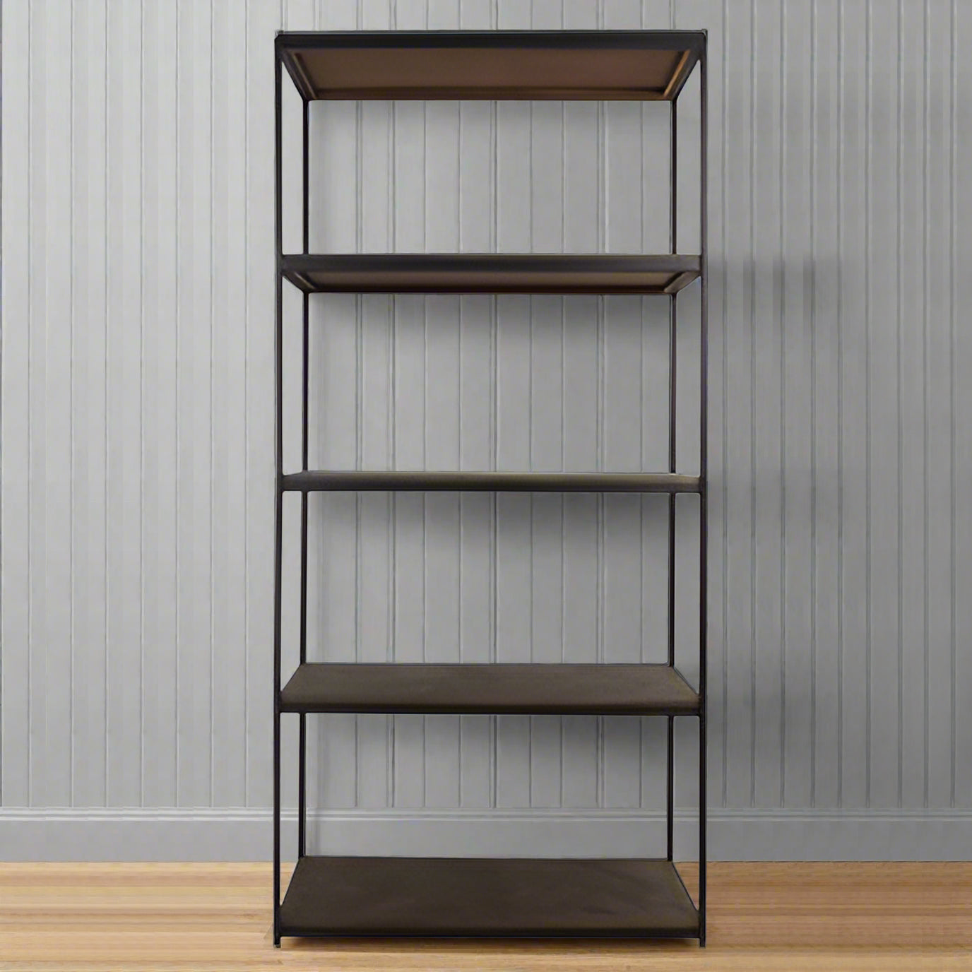 Tall shelving unit with solid mango wood shelves and a slim black metal frame in an industrial style.