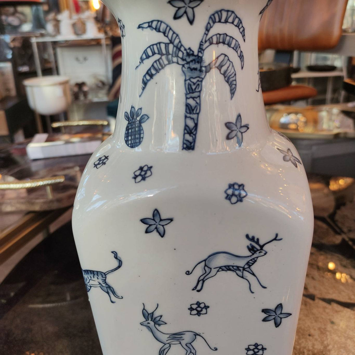 Blue and white ceramic vase,  Its  shape with a flared neck gives it a distinctive and elegant appearance, versatile for both traditional and contemporary interiors.