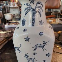 Blue and white ceramic vase,  Its  shape with a flared neck gives it a distinctive and elegant appearance, versatile for both traditional and contemporary interiors.