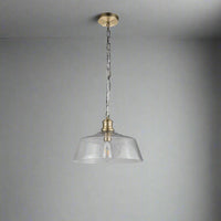 Textured glass pendant, wide shade set on a brass holder, chain and rose. The glass shade is wide enough to spread light in your kitchen, dining area or in your hall.