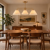 A mid-century modern dining room featuring the three light linear pendant.