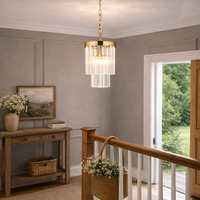 In an entrance hall, over stairway in a country cottage setting.