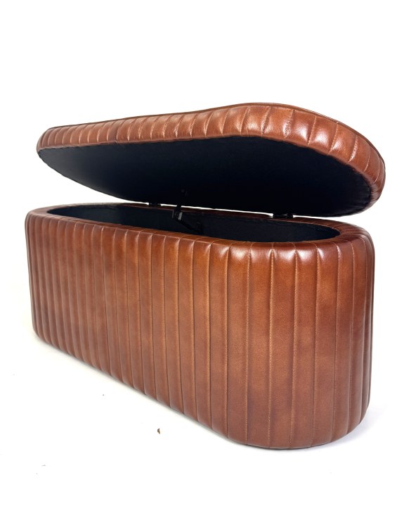 Image of the ribbed leather trunk partially open to view the interior on a white background