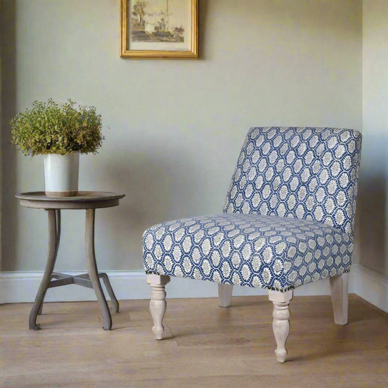 A blue and grey paisley cotton fabric chair with limewashed turned legs. A really pretty occasional chair which will pop in any interior.&nbsp; The colour would work in most modern and period himes, to brighten a corner in a bedroom or living room where extra seating is always a bonus.&nbsp; A sturdy mango frame is upholstered in a beautiful blue cotton with grey floral medallions.&nbsp; 