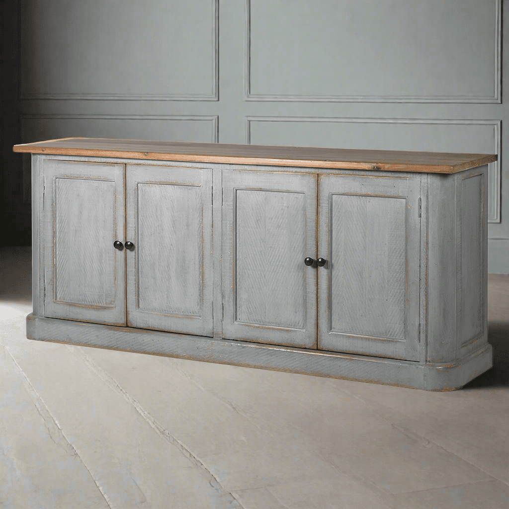 It's the perfect addition to your period home. Its distinctive distressed grey blue finish and old pine surface give it a sense of history and character. This sizeable sideboard offers ample storage, including adjustable shelving. It's a versatile piece that works beautifully in the kitchen, dining room or living room. With rustic, charming appeal, this sideboard is a great choice for a period setting.