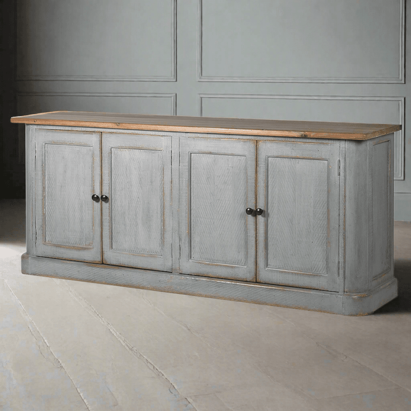 It's the perfect addition to your period home. Its distinctive distressed grey blue finish and old pine surface give it a sense of history and character. This sizeable sideboard offers ample storage, including adjustable shelving. It's a versatile piece that works beautifully in the kitchen, dining room or living room. With rustic, charming appeal, this sideboard is a great choice for a period setting.