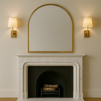 Antique brass metal, arched mirror. A great overmantle shape, perfect for a period home with it's antiqued metal frame.&nbsp; Would also work in an industrial setting over a cast iron fireplace.The distressed brass frame on this mirror adds to its vintage quality.