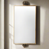 Perfect bathroom or wall dressing table mirror. A brass and bronze framed swivel mirror which can be hung vertically or horizontally.This mirror has metal work that has bronze and black distressed paintwork to the finish adding to it's overall industrial feel.