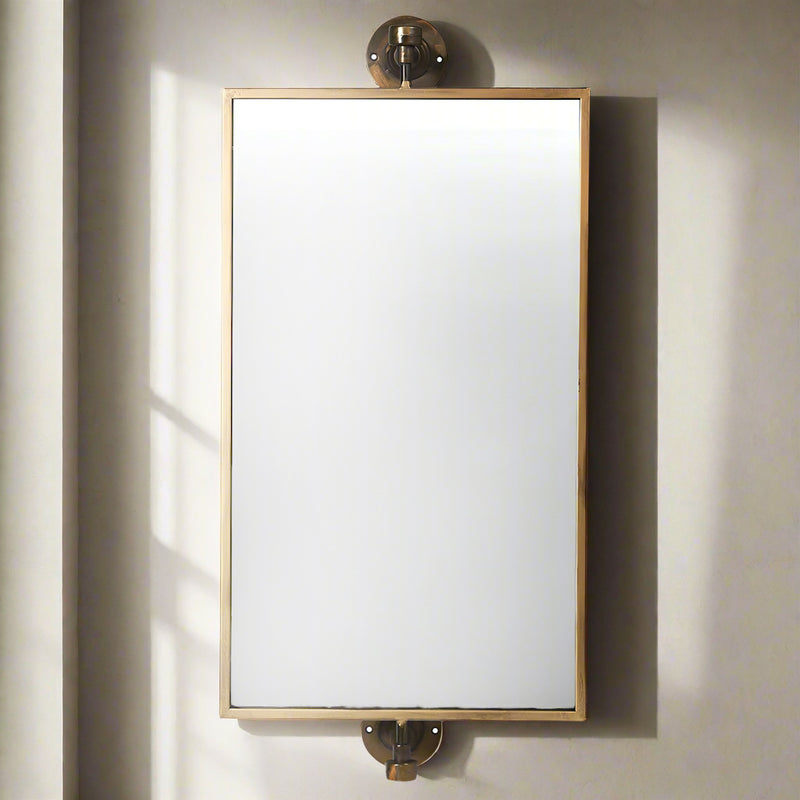 Perfect bathroom or wall dressing table mirror. A brass and bronze framed swivel mirror which can be hung vertically or horizontally.This mirror has metal work that has bronze and black distressed paintwork to the finish adding to it's overall industrial feel.