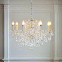 White shallow 8-arm crystal chandelier with faceted crystal droplets.