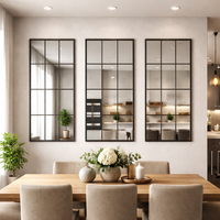Three large window mirrors placed above a dining table in a kitchen/diner area.
