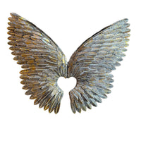 Decorative angel wings with a heart cutout on a white background