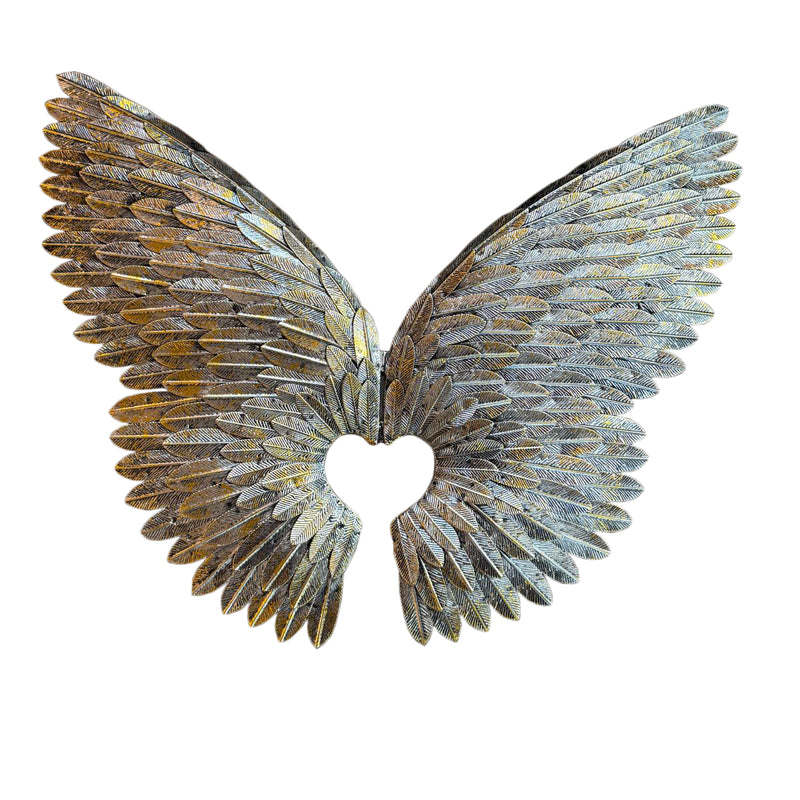 Decorative angel wings with a heart cutout on a white background