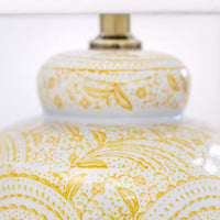 Add a pop of warmth and personality to your home with this yellow ceramic table lamp. Featuring a stunning hand-painted swirl design in sunshine yellow on a glossy white base, this lamp combines artistic charm with functional lighting. Its eye-catching pattern brings an uplifting, cheerful vibe, perfect for creating a welcoming atmosphere in your living room, bedroom, or entryway.

The classic ceramic base is paired with a neutral white lampshade, offering a timeless balance of color and texture. Whether yo