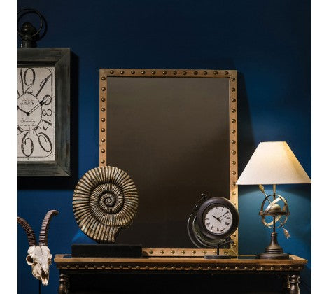 Studded wooden mirror.