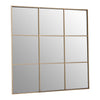 A nine pane square window mirror in a gold painted metal.