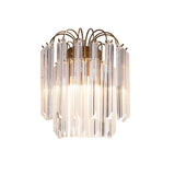 A feature wall light with crystal prisms hung from an antique brass frame that exudes glamour and luxury.  H: 29 cm W: 30 cm D: 18 cm  Weight: 3.60 Kg