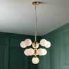 This opal glass cluster ball pendant is a sleek contemporary look for those looking to make a statement in a room.  Also available in a nickel finish.