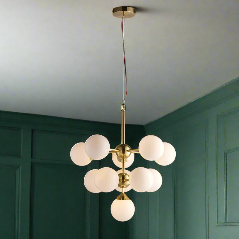 This opal glass cluster ball pendant is a sleek contemporary look for those looking to make a statement in a room.  Also available in a nickel finish.