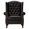 A replica of a typical Victorian button back armchair, in black leather with antique studding. Large and immensely comfortable.