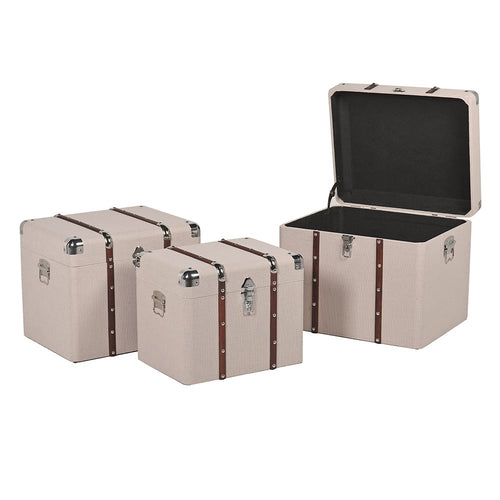 Beige Trunks With Wooden TrimsSet of 3 trunks in a light coloured fabric finish, with brass studded wooden strapping, nickel lock and nickel re-inforced corners. Bought individually or as a set of 3, offer beautiful storage in a bedroom or dressing room.