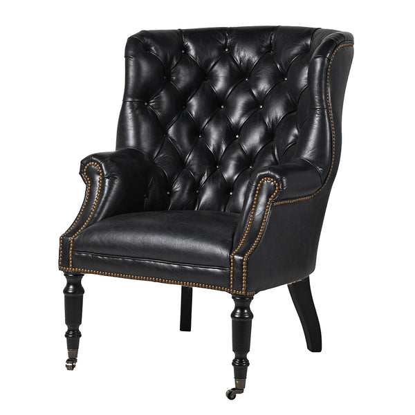 Tall, replica of a Georgian library chair in perfect soft black leather with a buttoned back and antique studding to the wing back and arms.  H: 109 cm W: 82 cm D: 85 cm