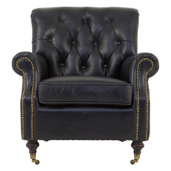 Classic black leather armchair, with cushion. Classic 'georgian style' leather chair on brass castor and wooden turned legs and trimmed with aged brass studs.